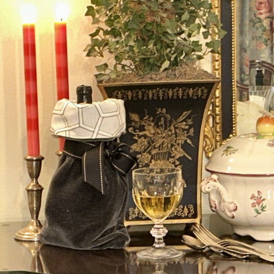 Our Wine Gift Bags are a wonderful example of thoughtful upcycling. Solids and prints are combined to create a beautiful gift bag with a contrasting cuff and ribbon ties.