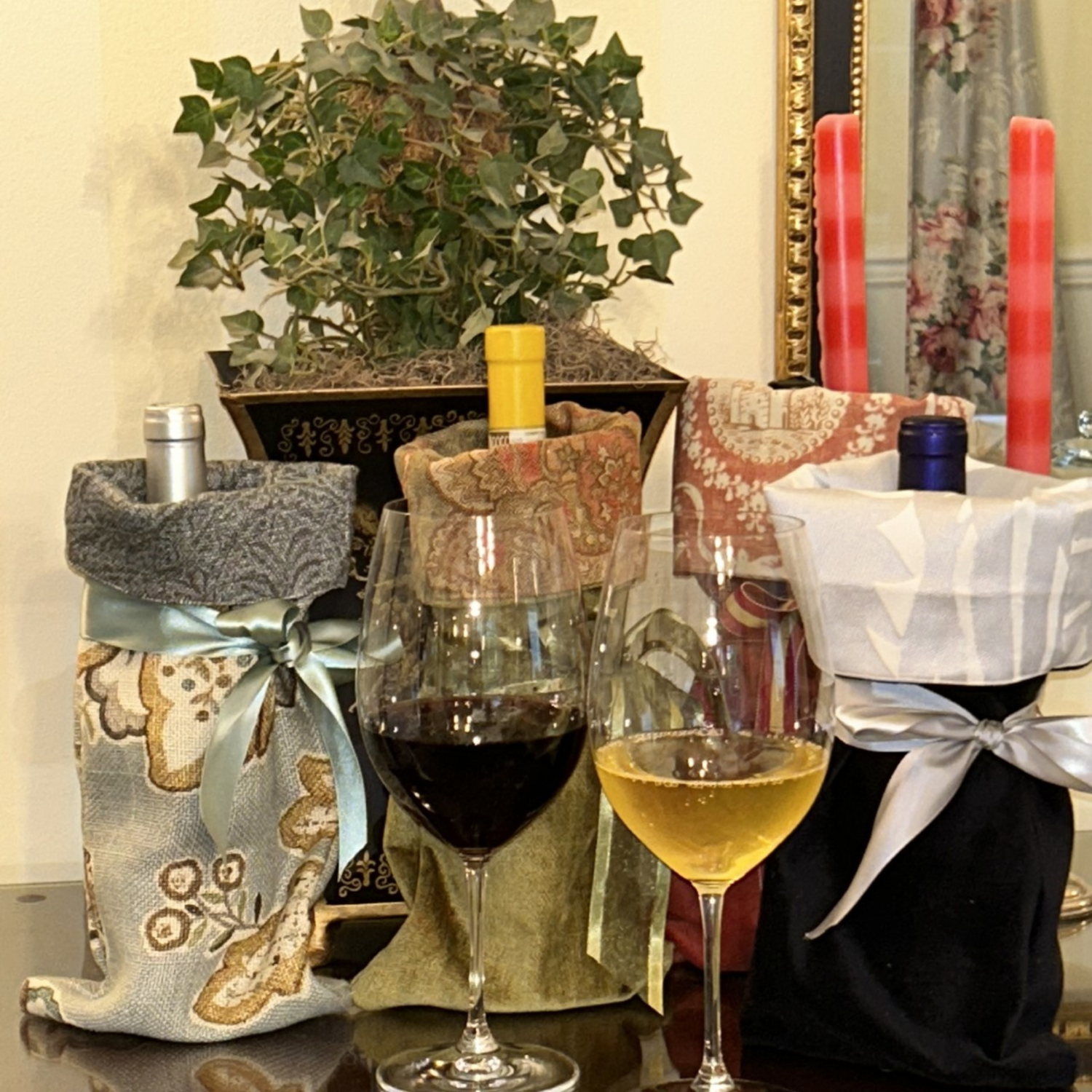 Our Wine Gift Bags are a wonderful example of thoughtful upcycling.  Solids and prints are combined to create a beautiful gift bag with a contrasting cuff and ribbon ties. 